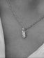 Silver chain necklace with a sparkling crystal leaf pendant, elegant and stylish accessory for any outfit.