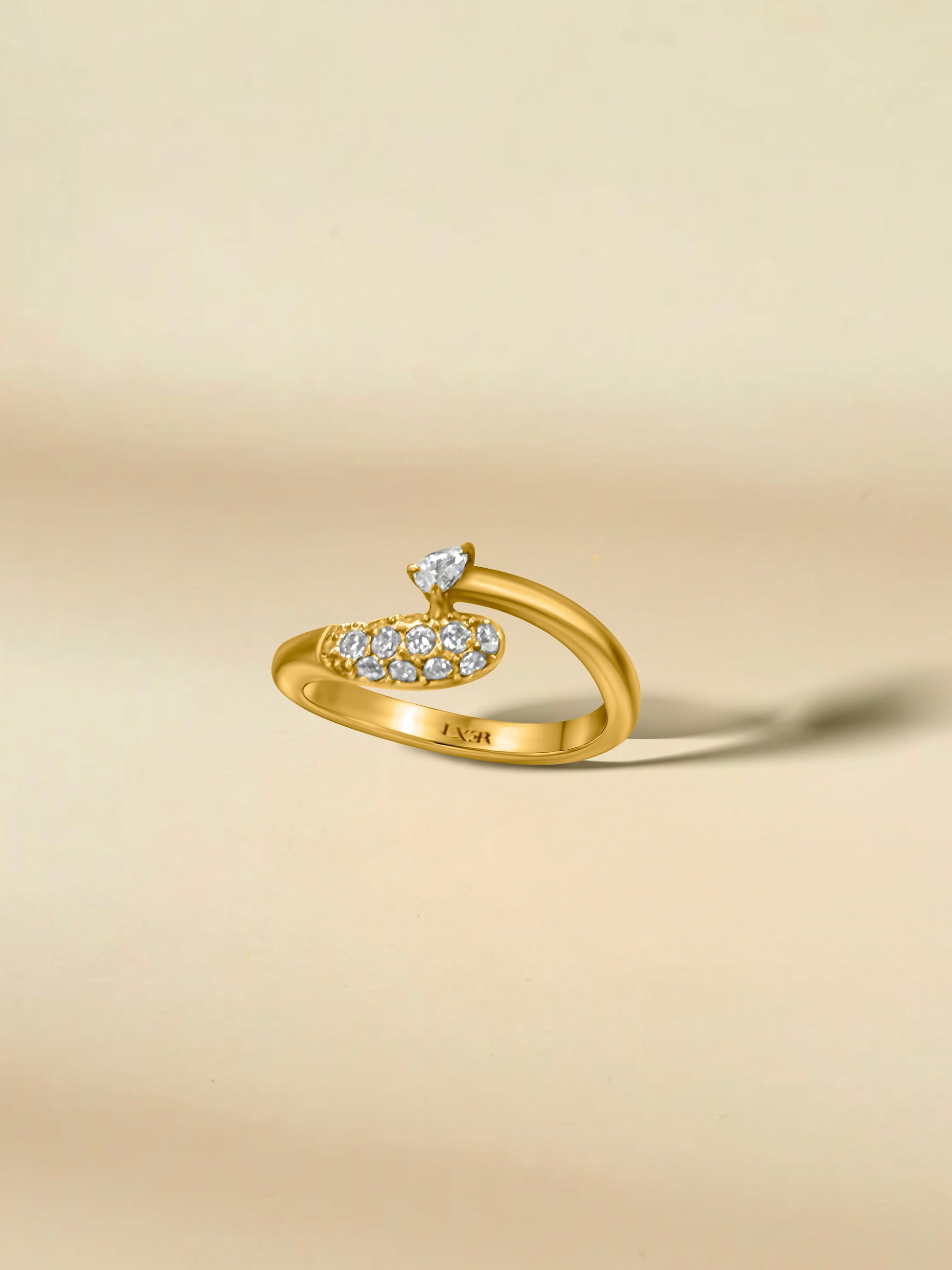 Elegant gold ring featuring sparkling diamond accents in a modern design.